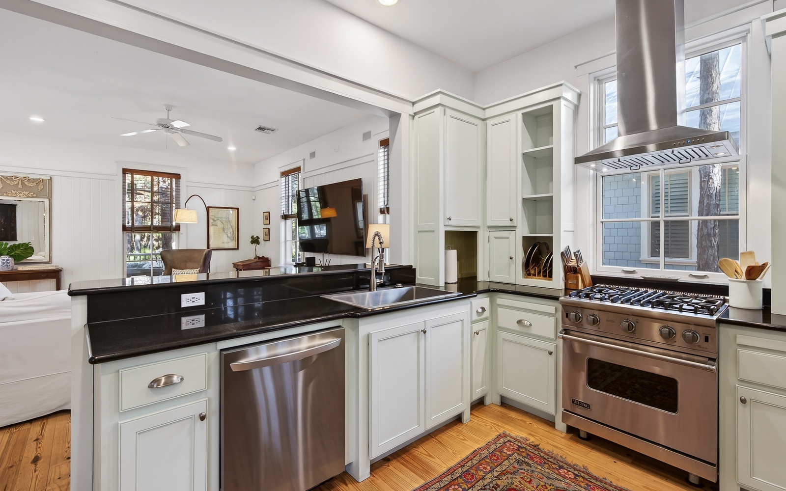 Your gourmet kitchen awaits with gleaming granite counters, professional-grade appliances, and elegant white cabinetry for inspired home cooking.