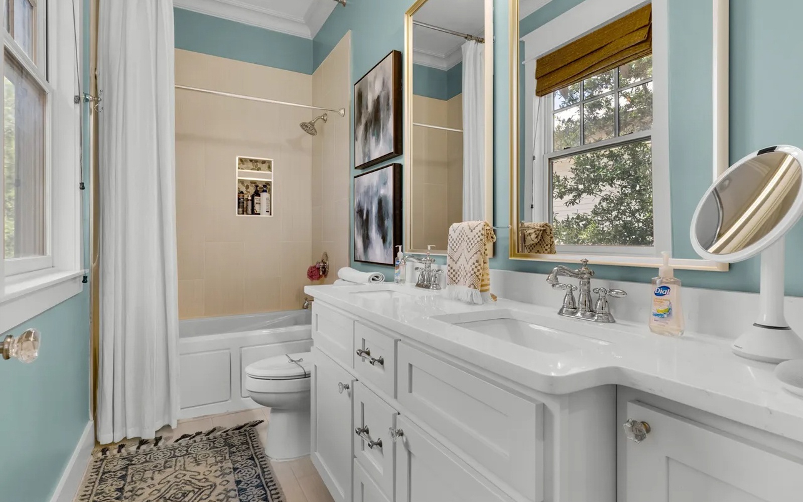 Your private bathroom features dual vanities with elegant marble countertops and a relaxing tub-shower combo for unwinding after busy days.