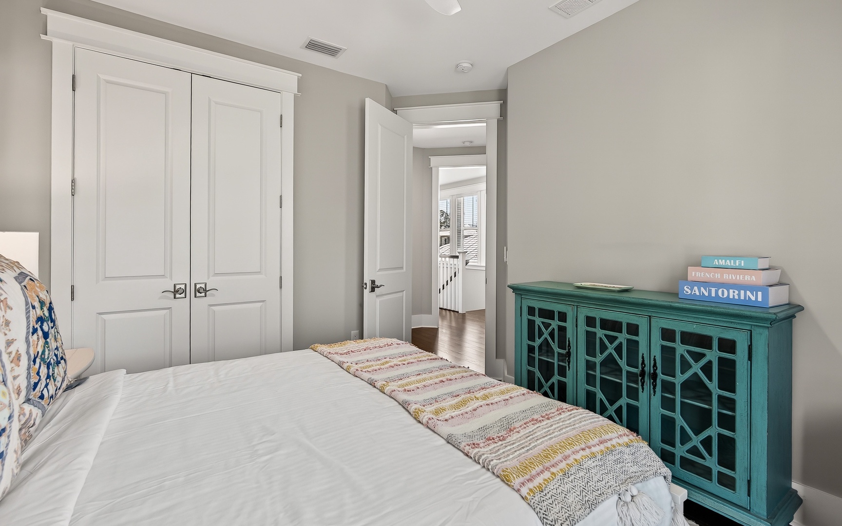 Sink into crisp white linens and enjoy the peaceful ambiance of your private retreat, complete with charming coastal-inspired furnishings.