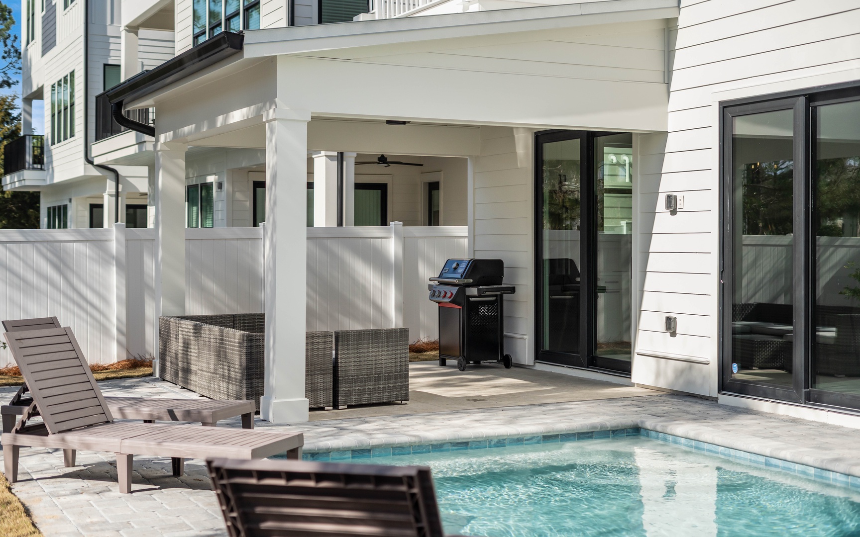 Your private pool paradise awaits with loungers for sunbathing, BBQ for grilling, and covered patio for relaxing.
