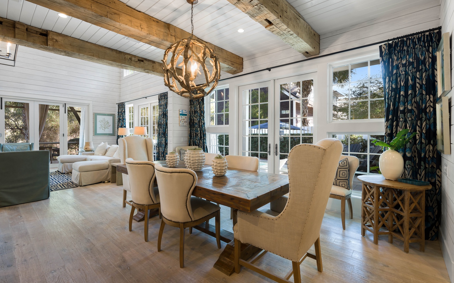 Gather around your stunning farmhouse dining table, where rustic beams meet coastal elegance for memorable meals together.