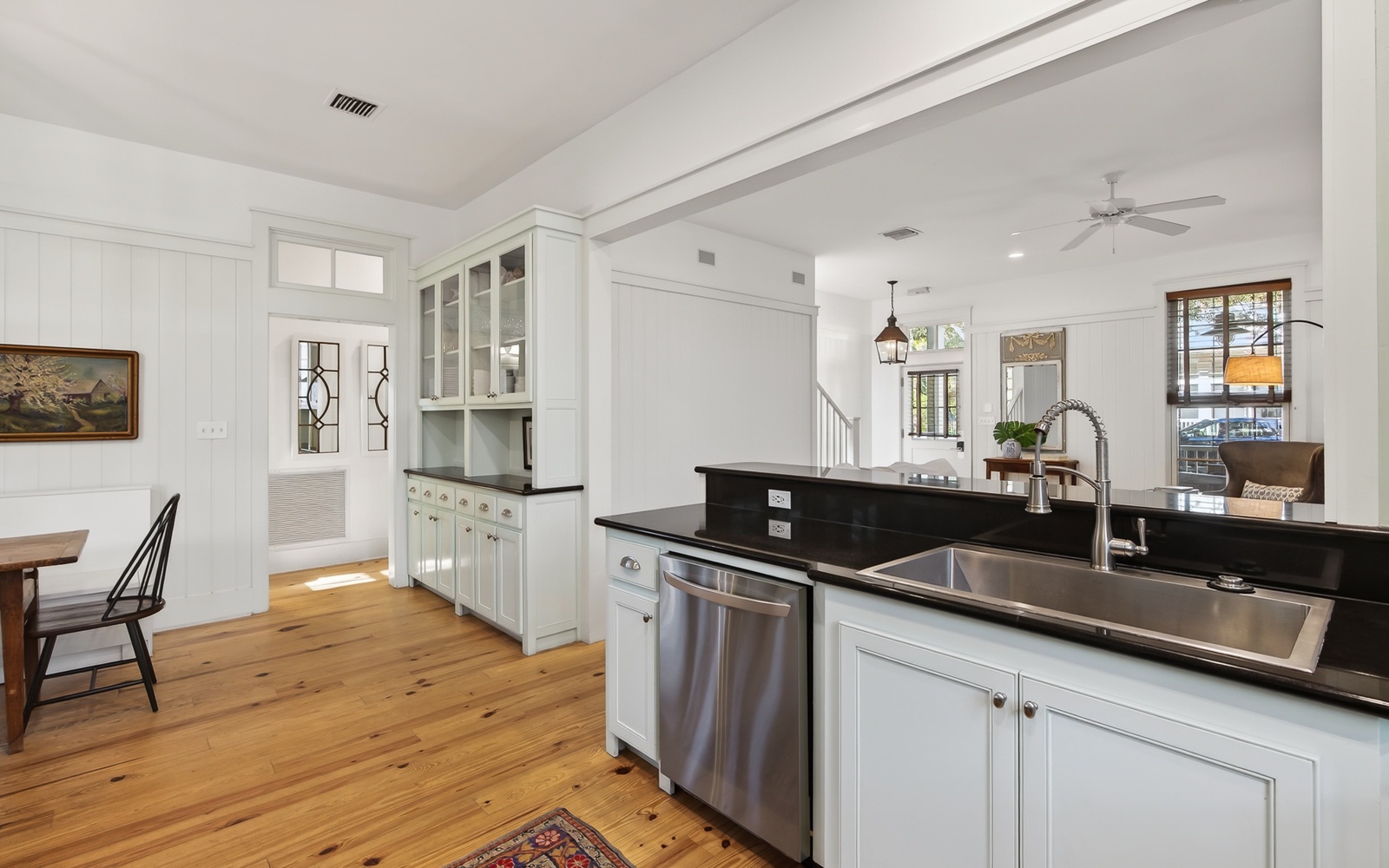 Your spacious kitchen features elegant white cabinetry, sleek granite countertops, and stainless steel appliances perfect for preparing memorable meals.