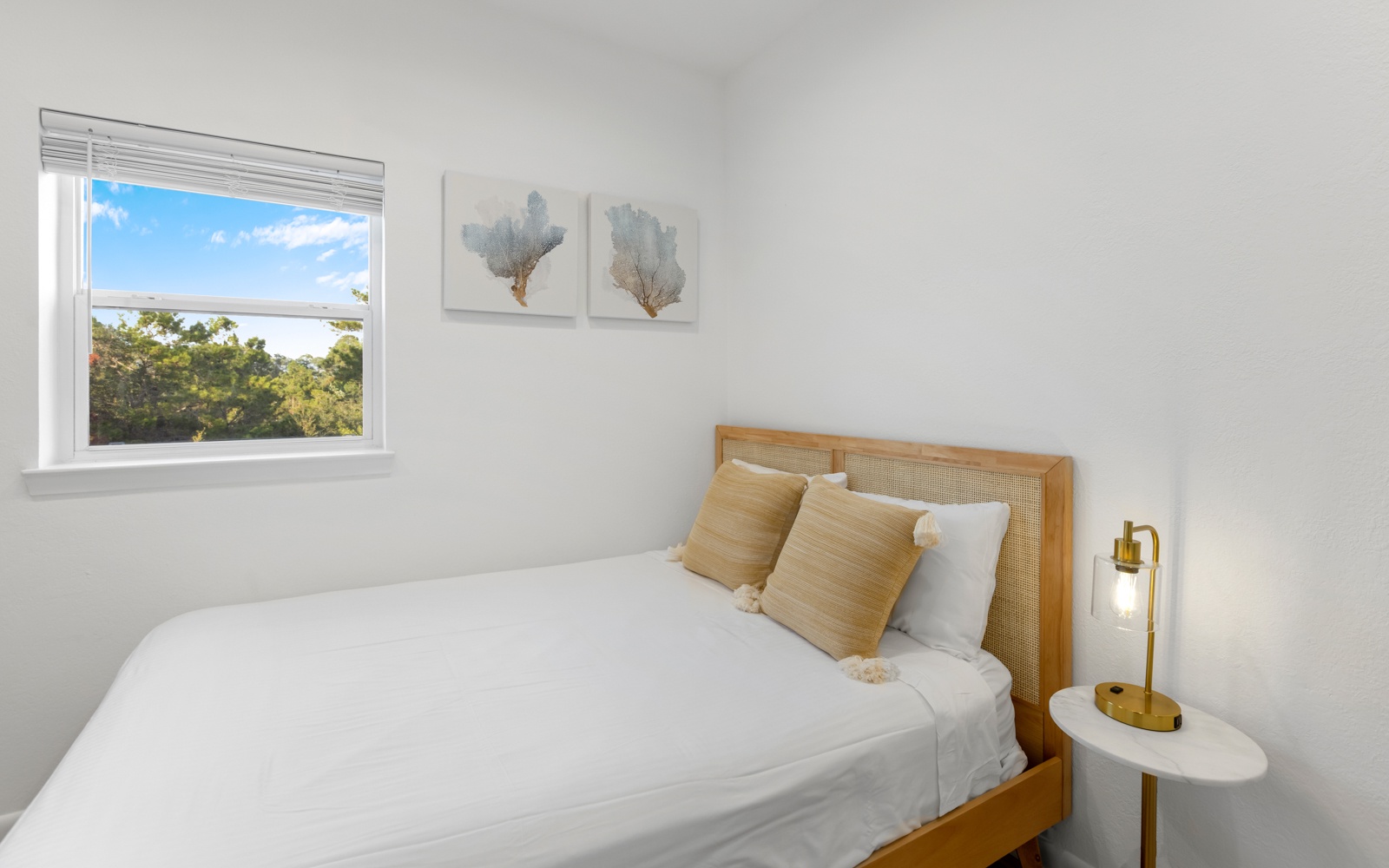 Wake up to natural light streaming through your window, showcasing peaceful treetop views that make each morning feel like a retreat.