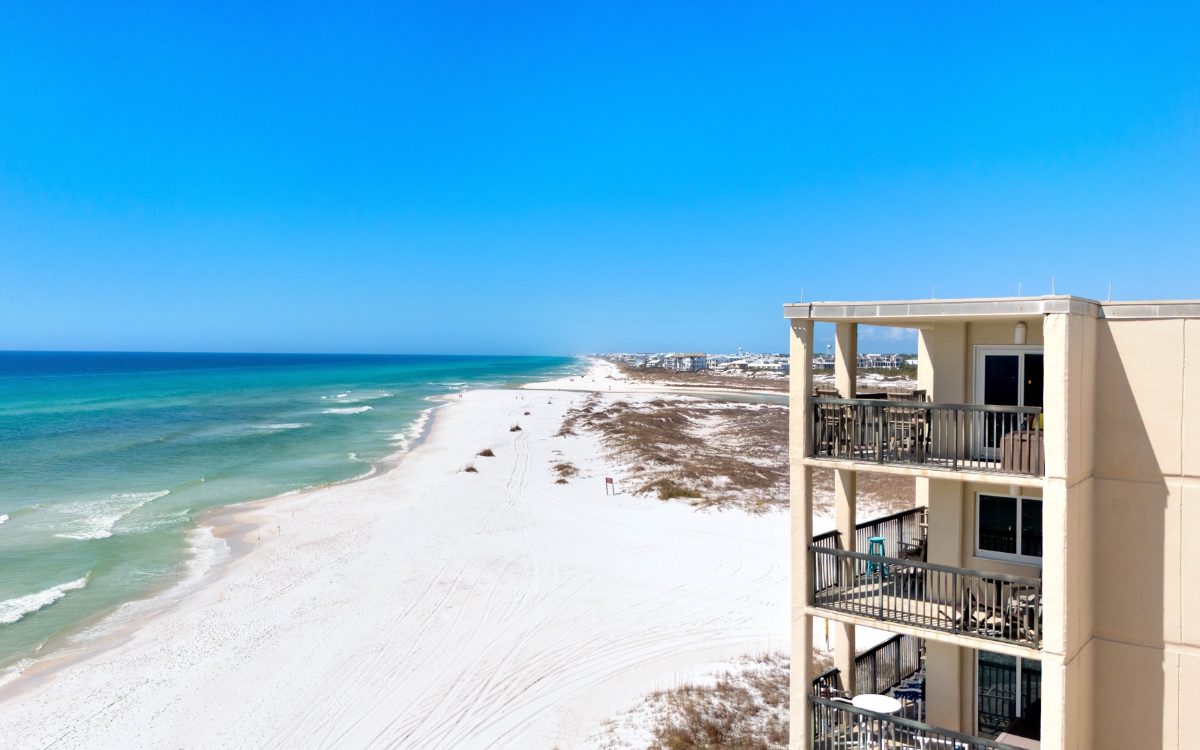 Beachfront property featuring stunning white sand beaches and emerald Gulf waters stretching endlessly along the pristine coastline.