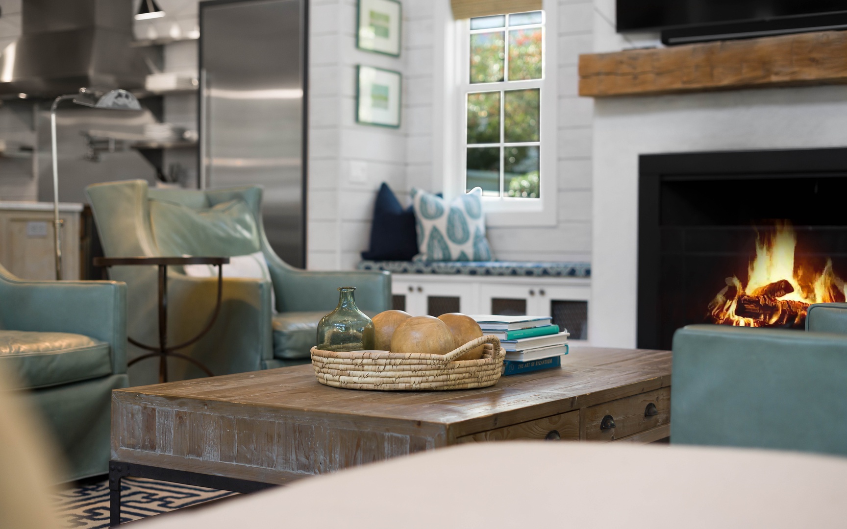 Unwind in your cozy living space where soft seating meets rustic charm, and a crackling fireplace creates the perfect ambiance for relaxing evenings.