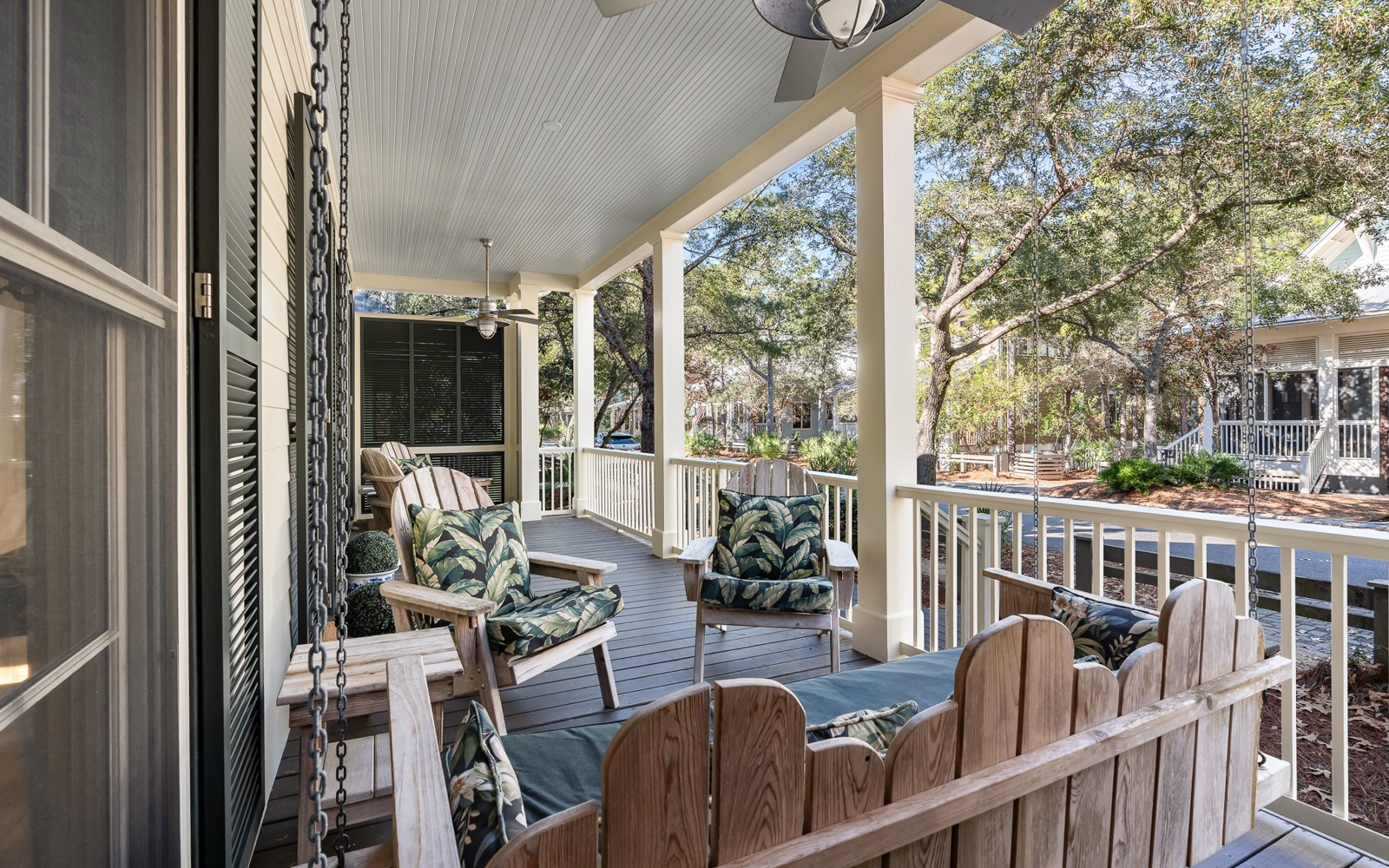 Unwind on your private covered porch with comfy seating and a gentle ceiling fan, perfect for morning coffee or evening relaxation.