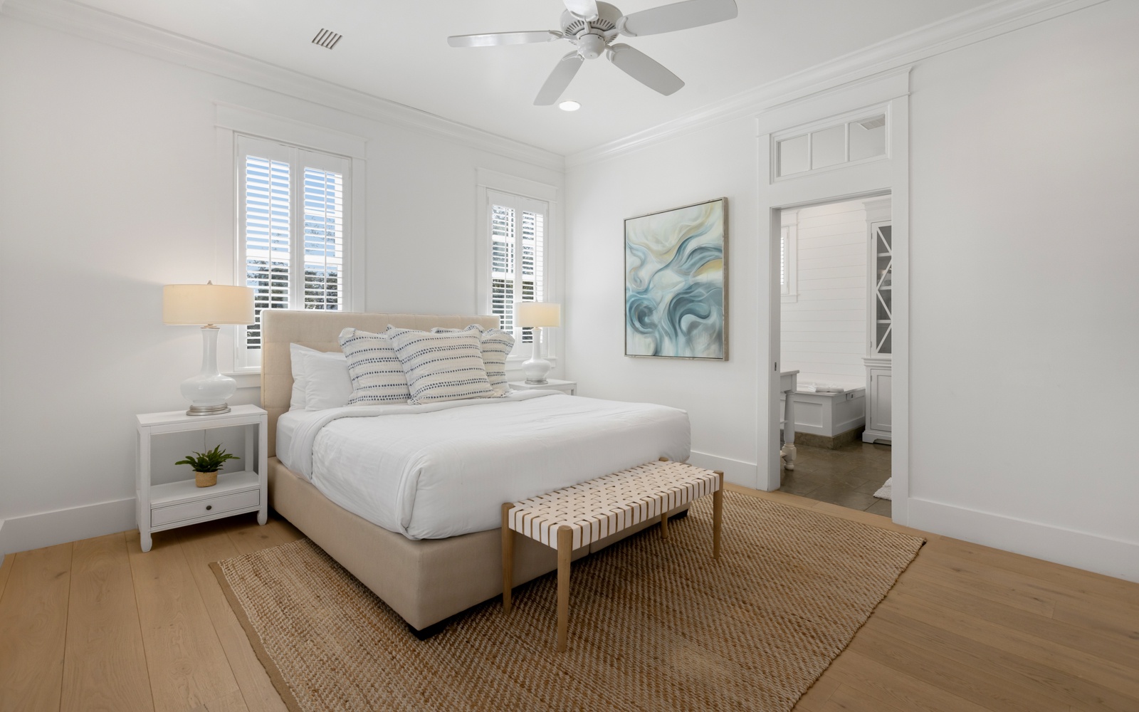 Your peaceful bedroom sanctuary features crisp linens, coastal artwork, and a private ensuite for ultimate comfort.