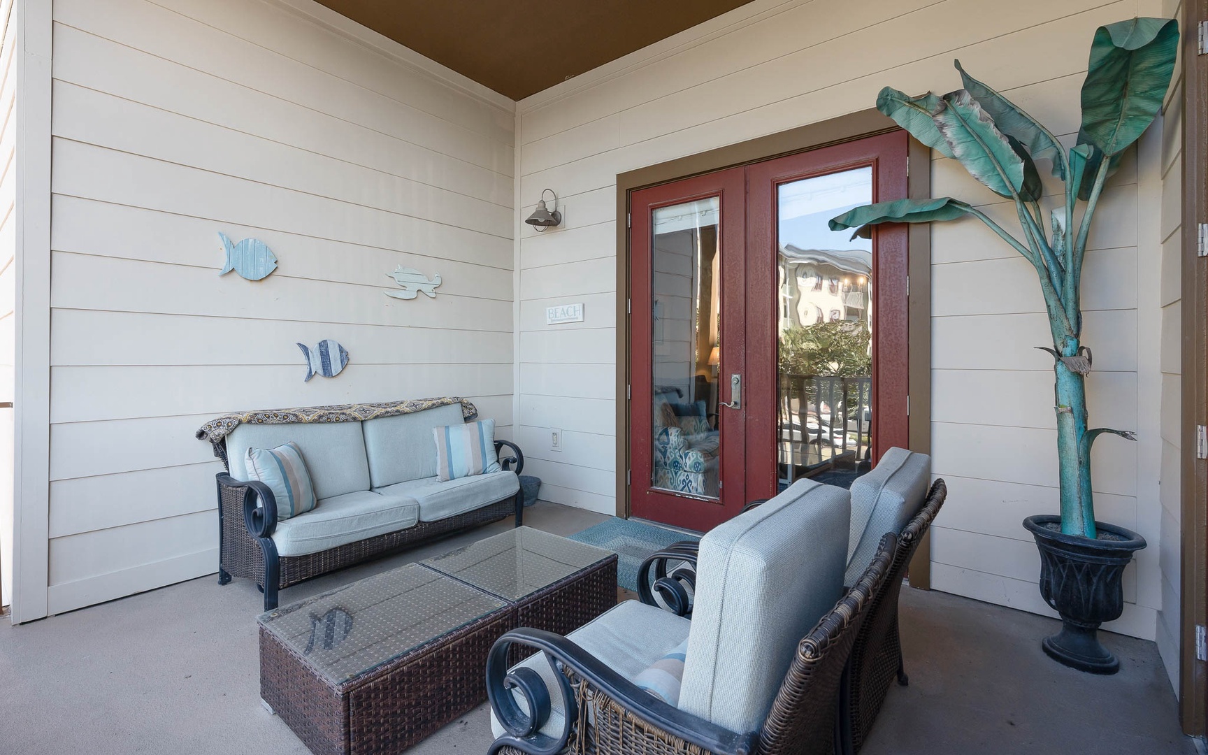 Your private covered patio offers comfortable seating where you can unwind with coastal breezes and peaceful moments outdoors.