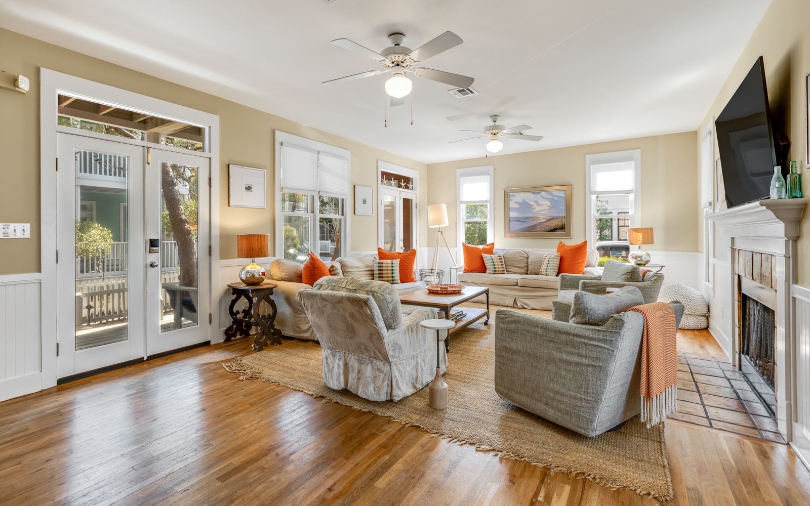 Relax in your spacious living room with cozy seating, warm fireplace, and French doors opening to your private outdoor space.