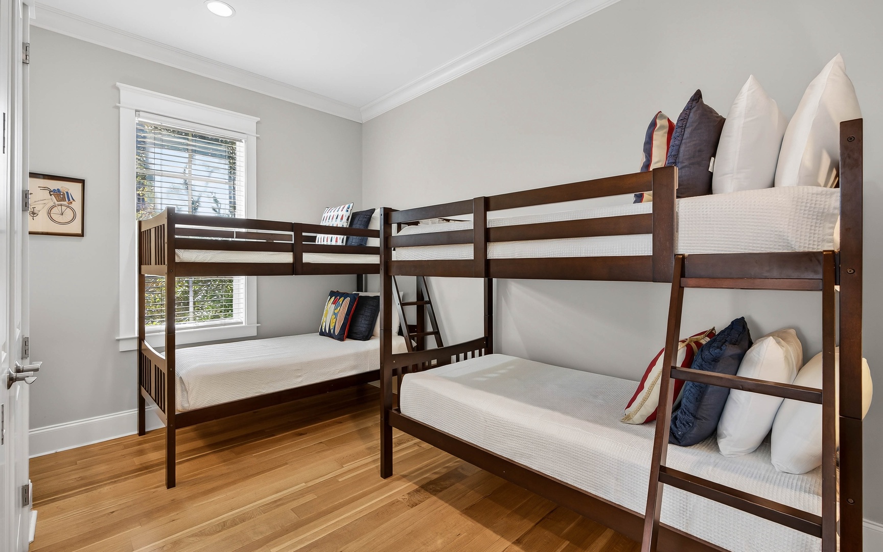 Your children will love this cozy bunk room with two sturdy wooden beds and soft linens for comfortable family stays.