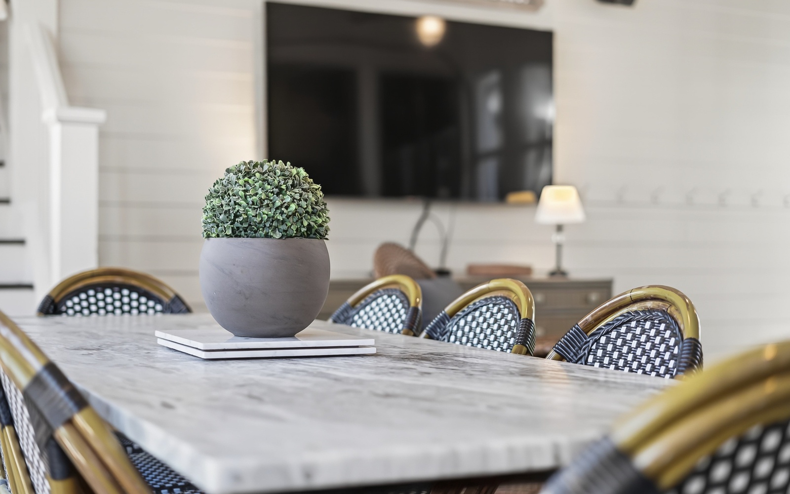 Gather around this elegant marble dining table where memorable meals and conversations await you.