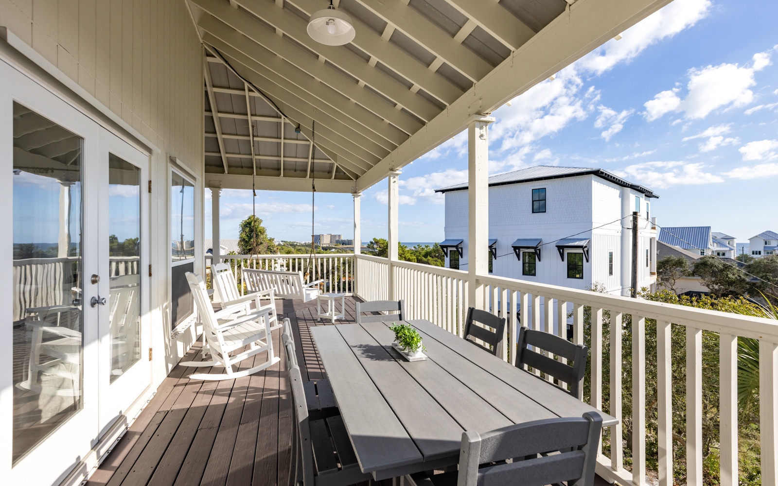 Your private covered deck offers the perfect spot for morning coffee or evening dining with ocean glimpses beyond.