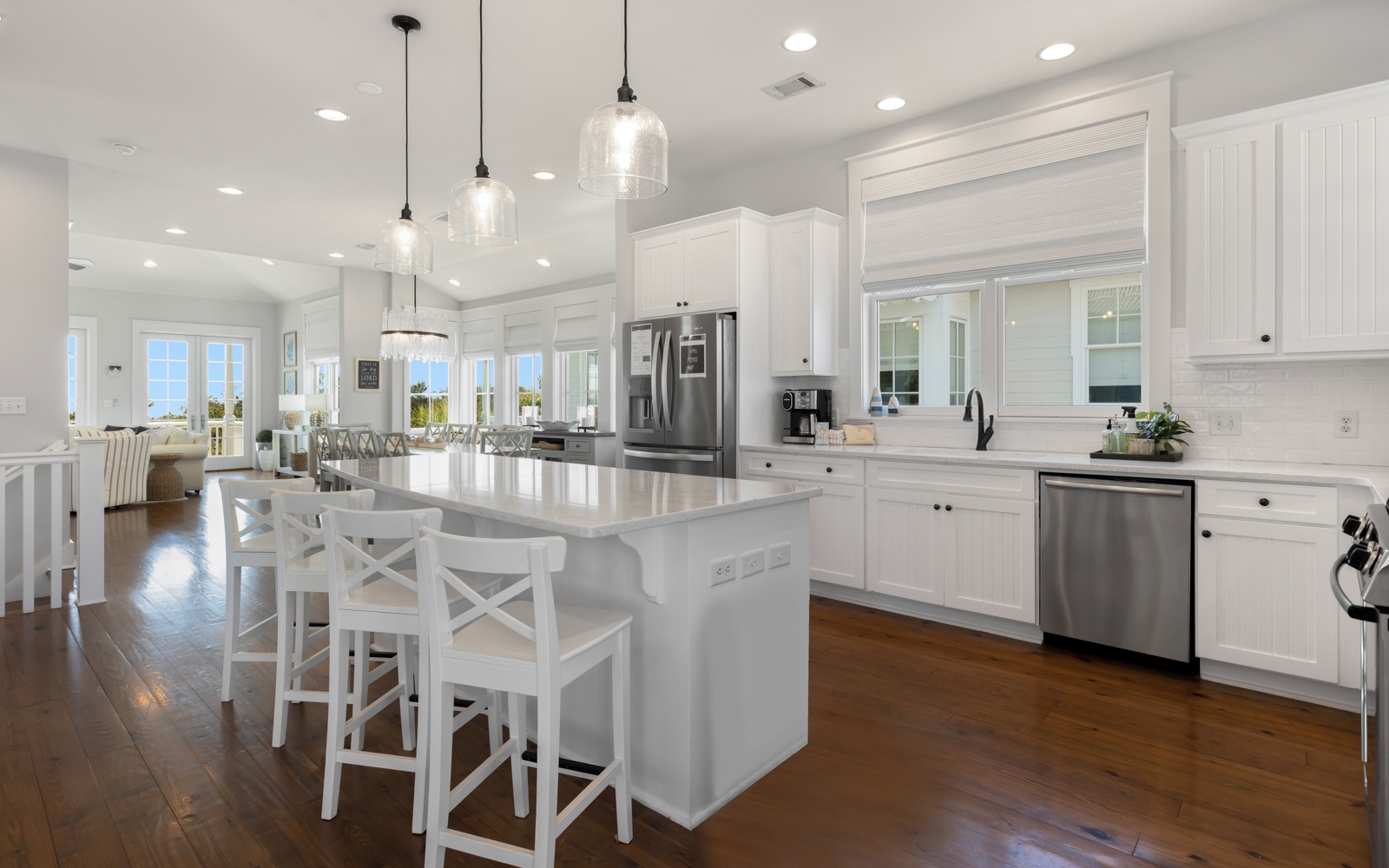 Your bright, spacious kitchen features marble countertops, stainless appliances, and island seating where you'll love gathering for morning coffee or meal prep.
