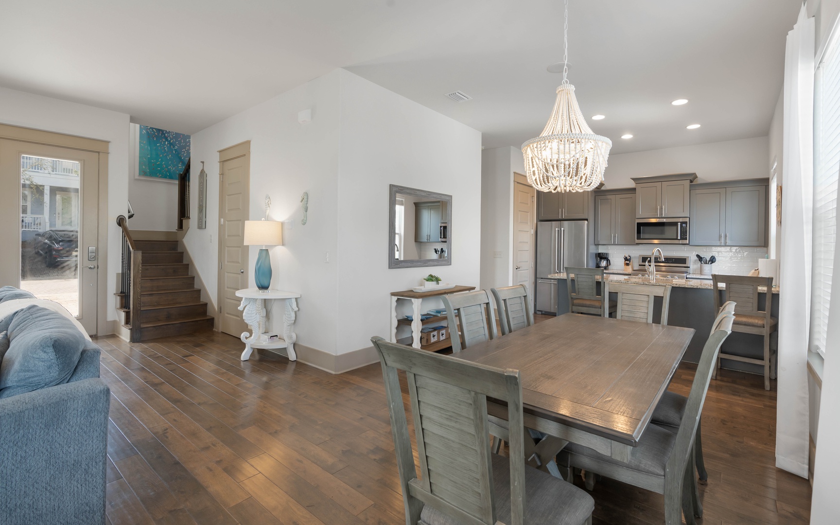 Your open-concept living space flows seamlessly from kitchen to dining, perfect for gathering and creating memories together.