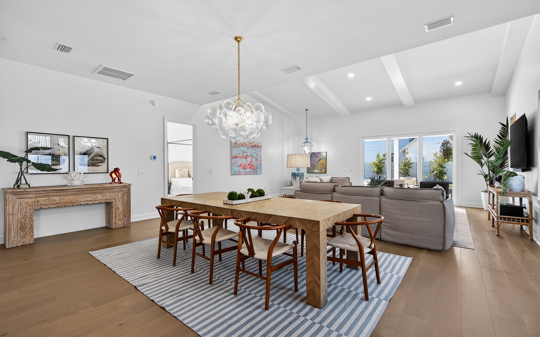 Your spacious living and dining area flows beautifully with natural light streaming through large windows, perfect for memorable meals and relaxing evenings.