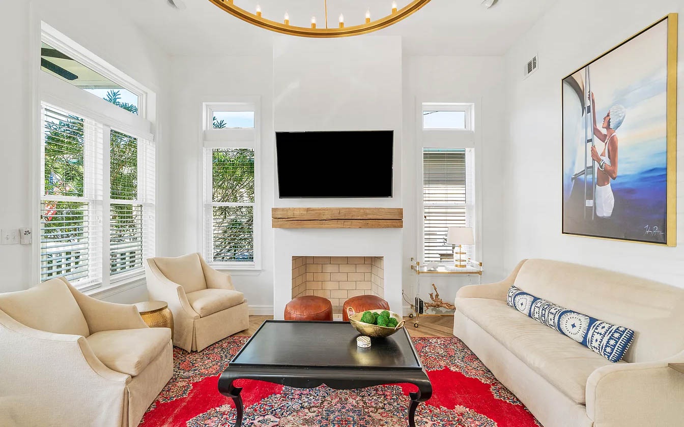 Relax in your bright living room with cozy seating, warm fireplace, and entertainment center perfect for unwinding after adventures.