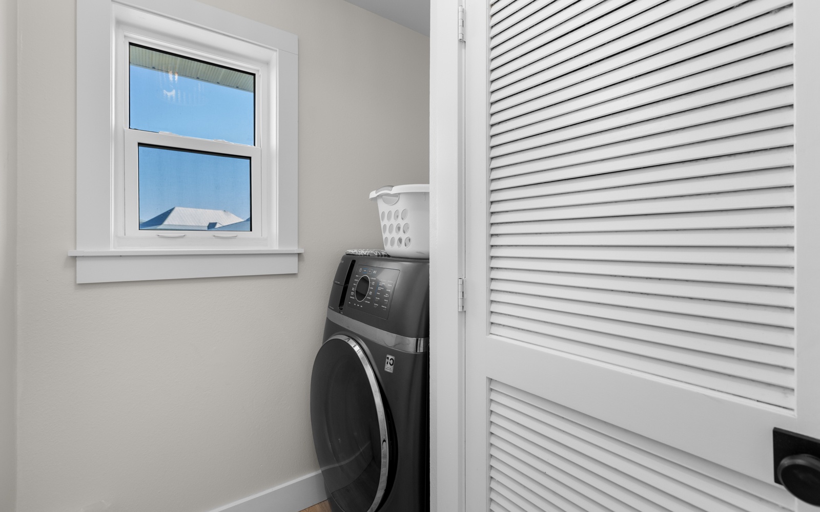 Keep your clothes fresh with your own private washer and dryer, tucked away in this convenient laundry closet for easy access.
