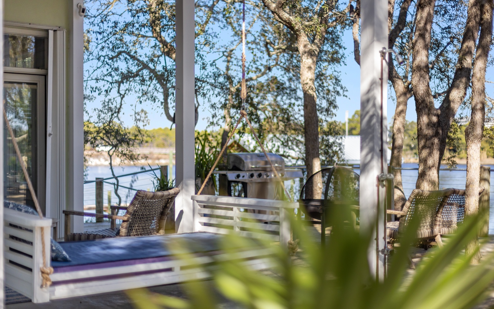 Your private terrace beckons with waterfront views, where morning coffee tastes better surrounded by nature's tranquil embrace.