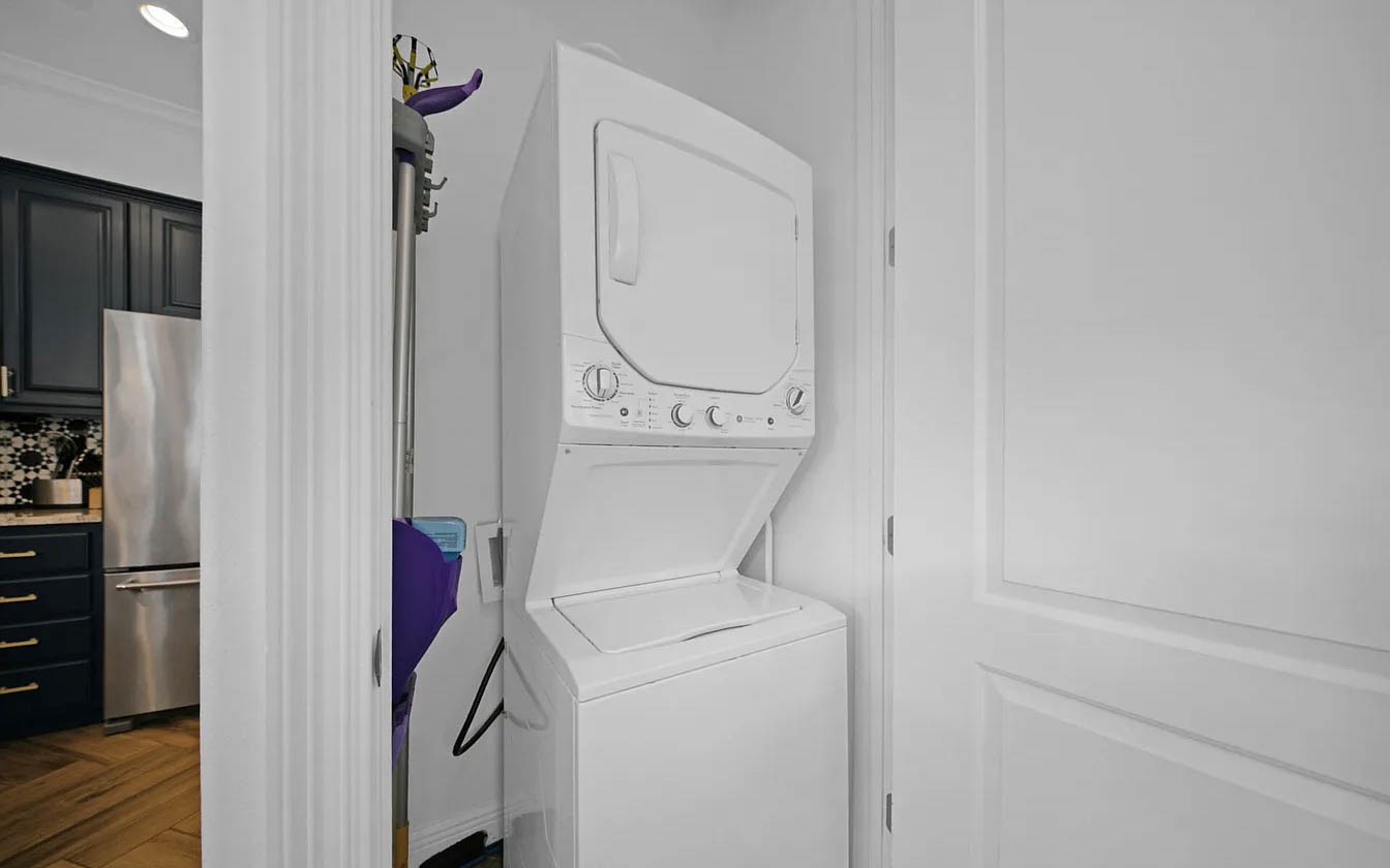 Your in-unit washer and dryer make extended stays effortless, tucked neatly in this convenient laundry closet.