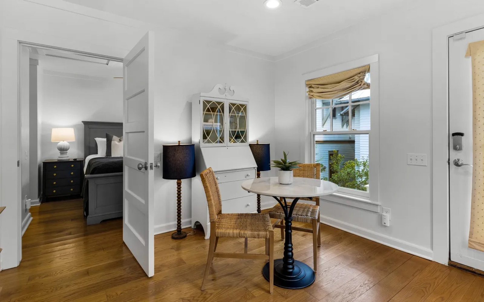 Your cozy writing nook awaits with a charming bistro table by sunny windows, while your restful bedroom beckons just steps away.