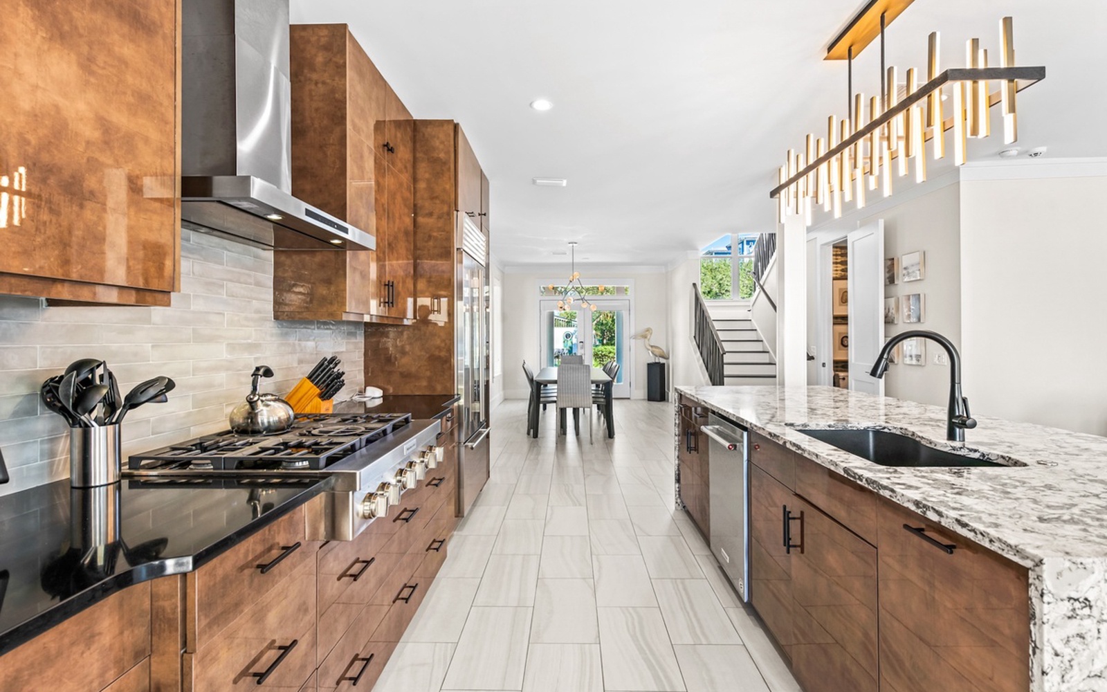 Your gourmet kitchen awaits with granite countertops, premium appliances, and gleaming wood cabinetry for culinary adventures.