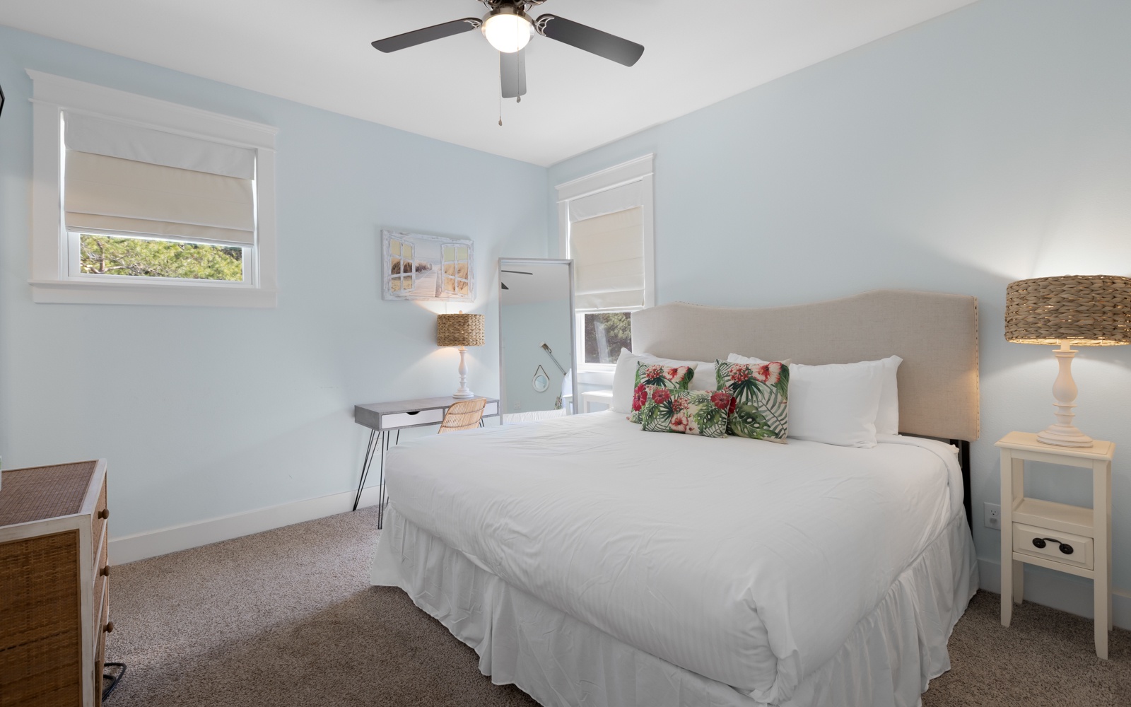 Rest peacefully in your serene bedroom with soft blue walls, crisp white linens, and natural light streaming through your windows.