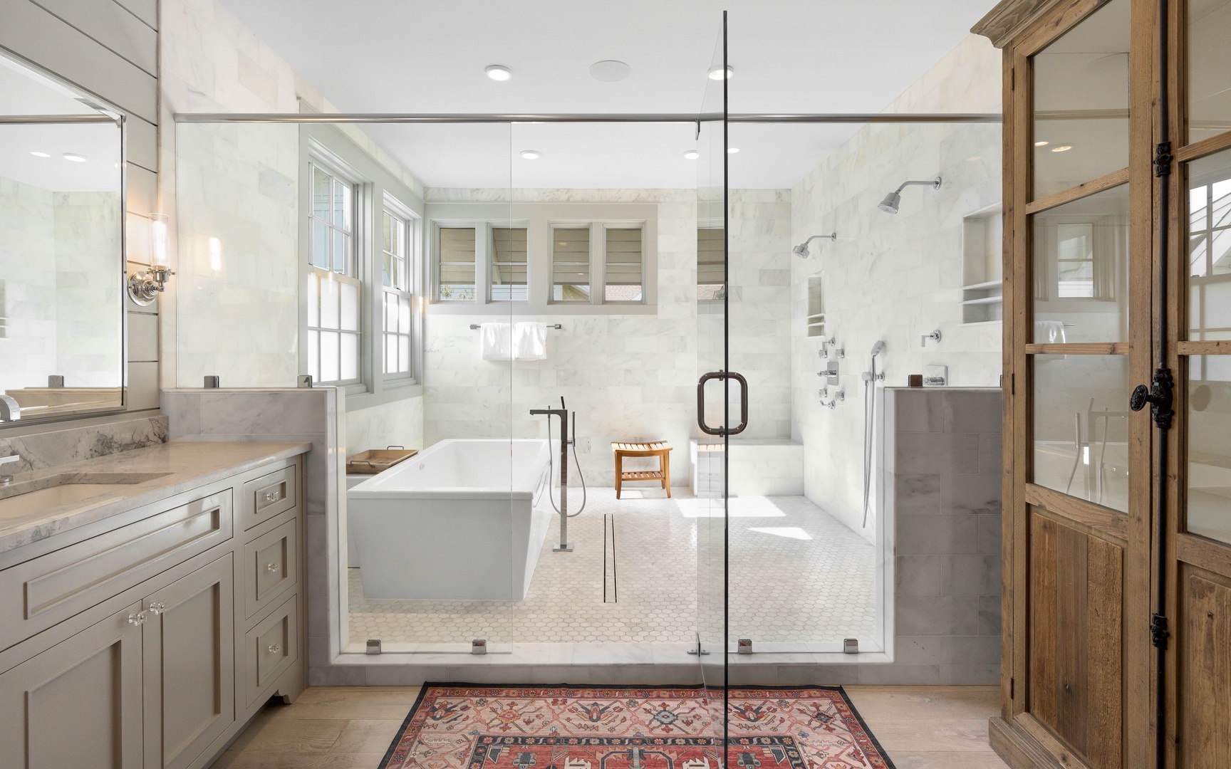 Luxurious spa-like bathroom with soaking tub, rainfall shower, and elegant finishes for your ultimate relaxation retreat.