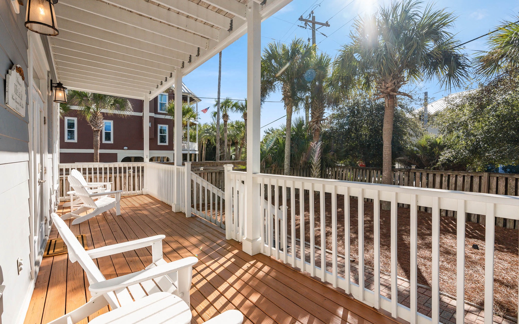 Your private deck offers tropical tranquility with comfortable seating and swaying palms—perfect for morning coffee or sunset relaxation.