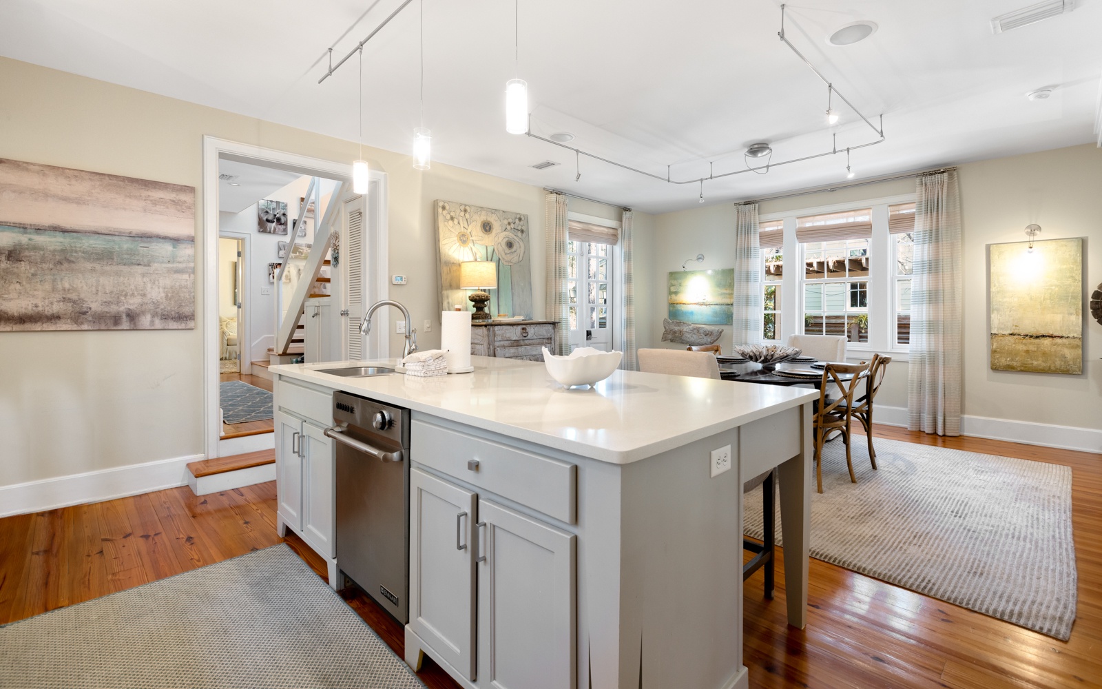 Your spacious kitchen features a gleaming marble island and modern appliances, perfect for preparing memorable meals during your stay.