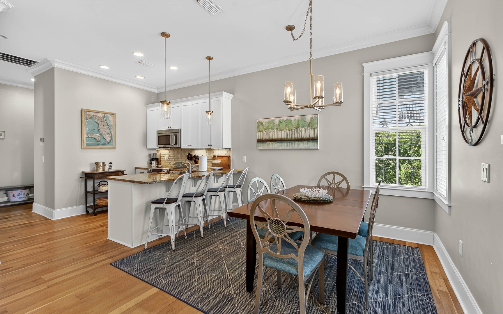 Gather around your elegant dining table for memorable meals, while the open kitchen invites culinary adventures with granite counters and modern appliances.