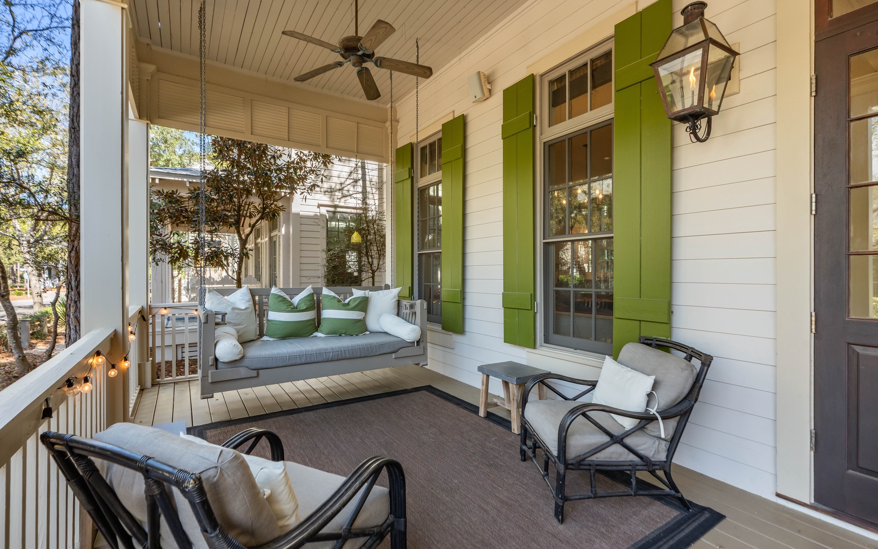 Your charming covered porch invites relaxation with a cozy swing bed and comfortable chairs, perfect for morning coffee or evening unwinding.