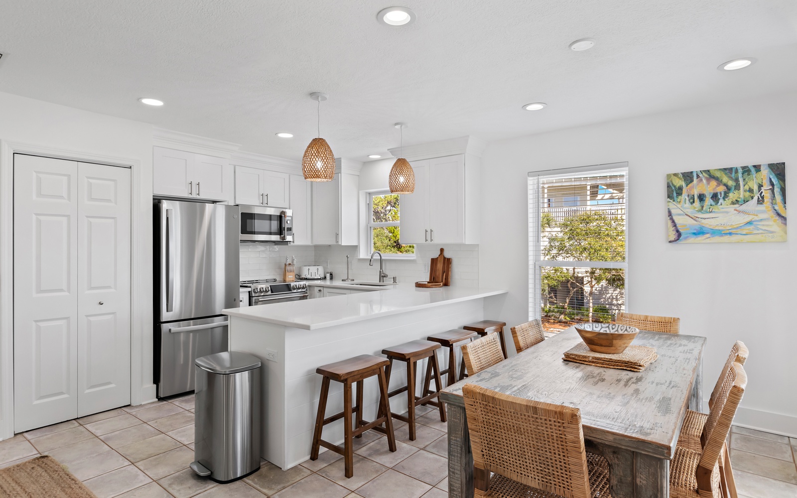 Your bright, modern kitchen flows seamlessly into the dining area, creating the perfect space for cooking and gathering together.