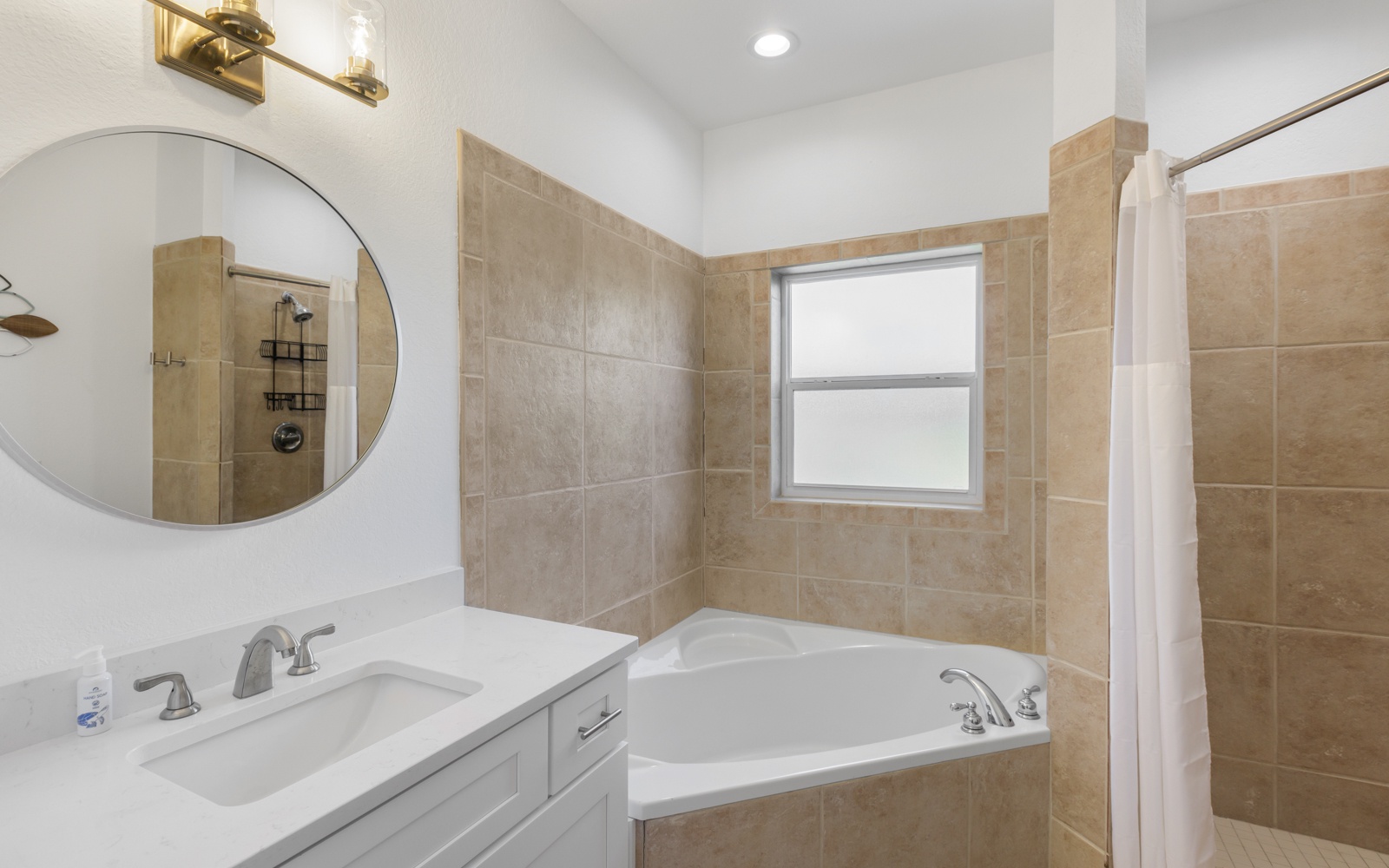 Unwind in your spa-like bathroom featuring a luxurious soaking tub, spacious walk-in shower, and elegant finishes for ultimate relaxation.