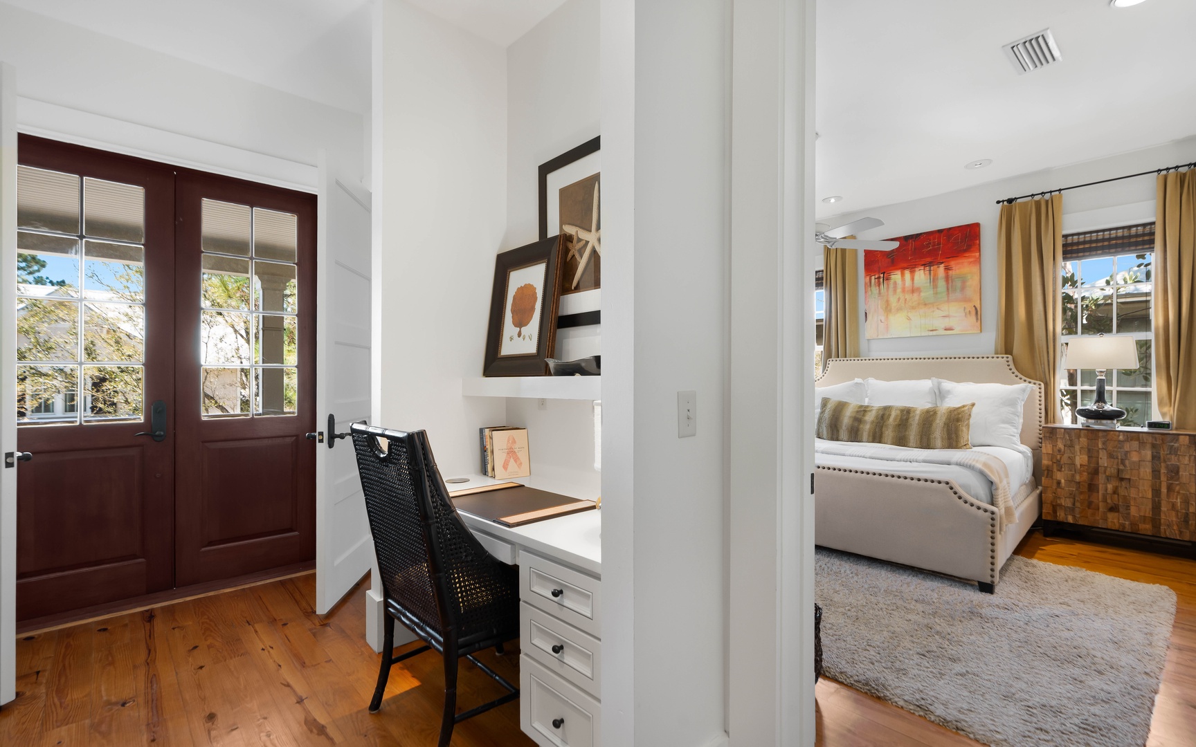 Unwind in your elegant bedroom suite with a cozy workspace nook, perfect for catching up on emails before sinking into plush bedding.