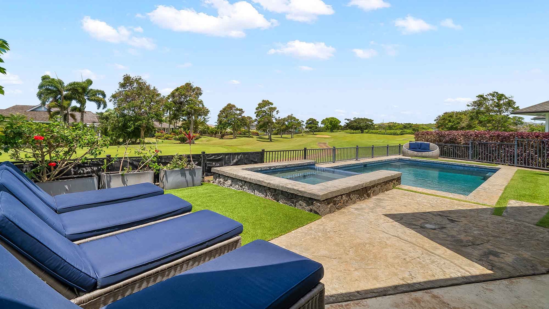 Stretch out on plush poolside loungers and soak up the sun while overlooking lush fairways. Your private oasis features a heated spa and sparkling pool, perfect for unwinding after a day of island adventures.