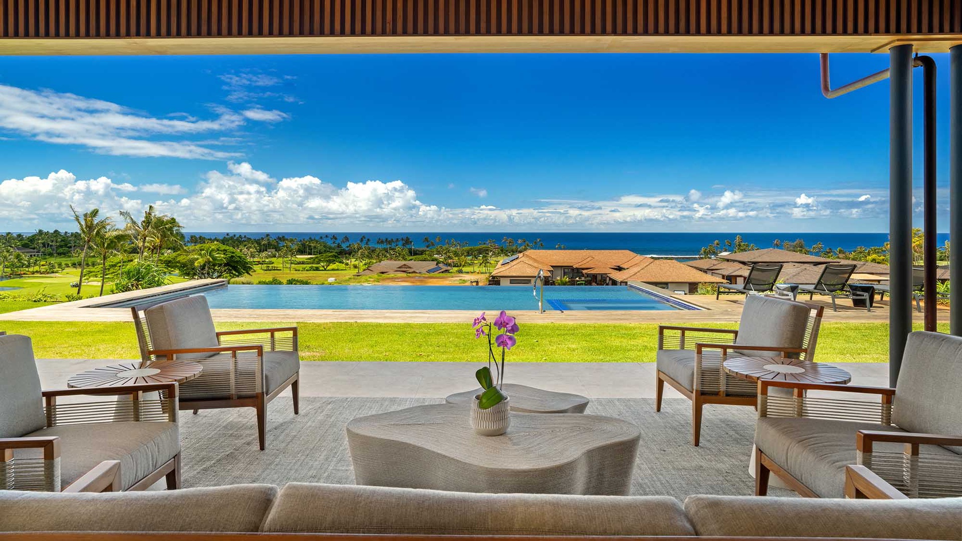 Unwind in your private covered lounge, where plush seating frames stunning views of the infinity pool, lush grounds, and sparkling ocean beyond—your own slice of paradise.