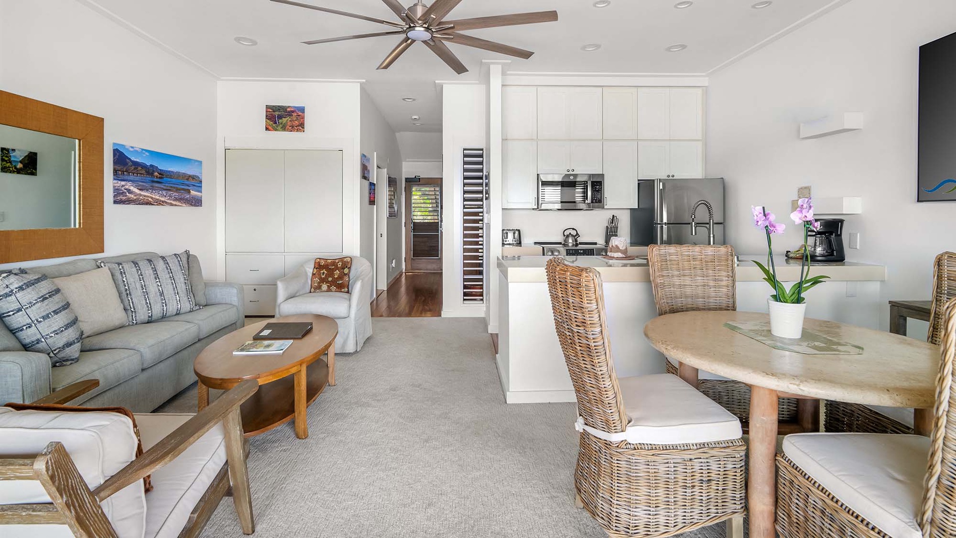 Your open-concept retreat blends cozy living, dining, and kitchen spaces—perfect for relaxing or sharing meals. Tropical touches and coastal breezes invite you to unwind in style.