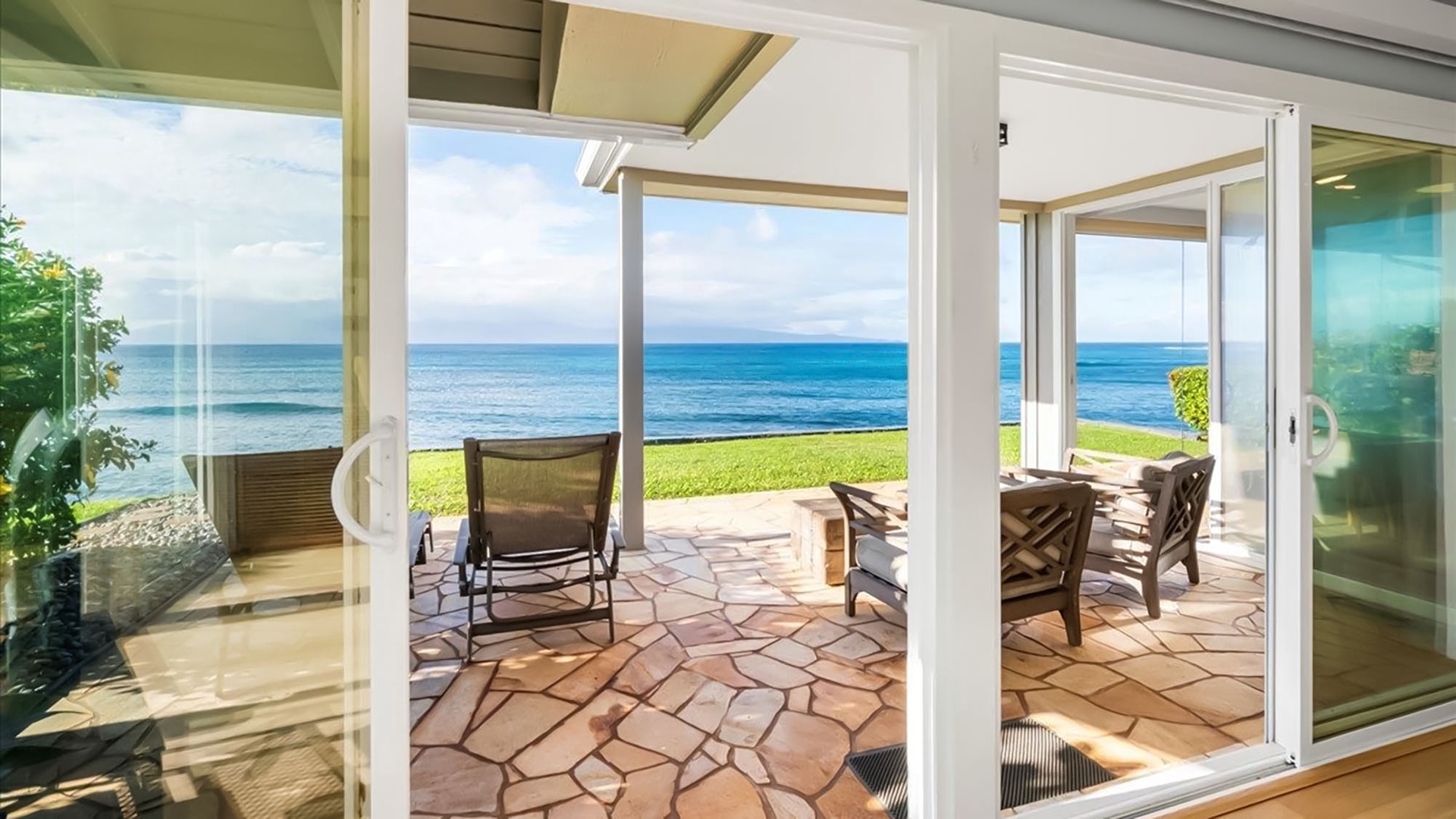 Step through sliding doors onto your private patio where ocean breezes and endless sea views create the perfect beachfront retreat.