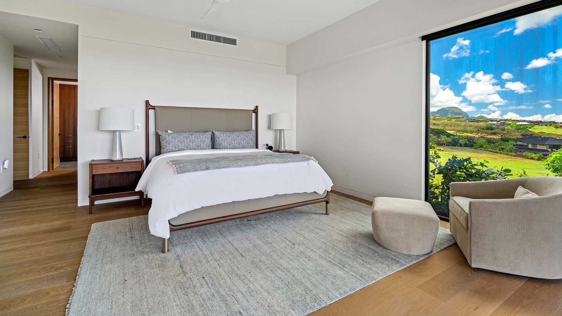 Sink into crisp linens and wake to lush golf course views through your floor-to-ceiling windows—pure serenity awaits.