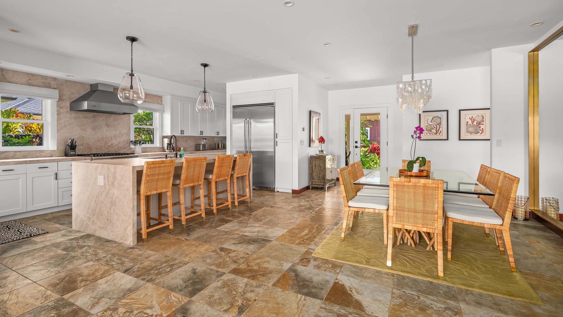 Picture yourself sipping morning coffee at the sleek island, chatting over meals at the elegant dining table, and preparing feasts in this bright, open kitchen where every corner invites comfort, connection, and unforgettable moments with loved ones.