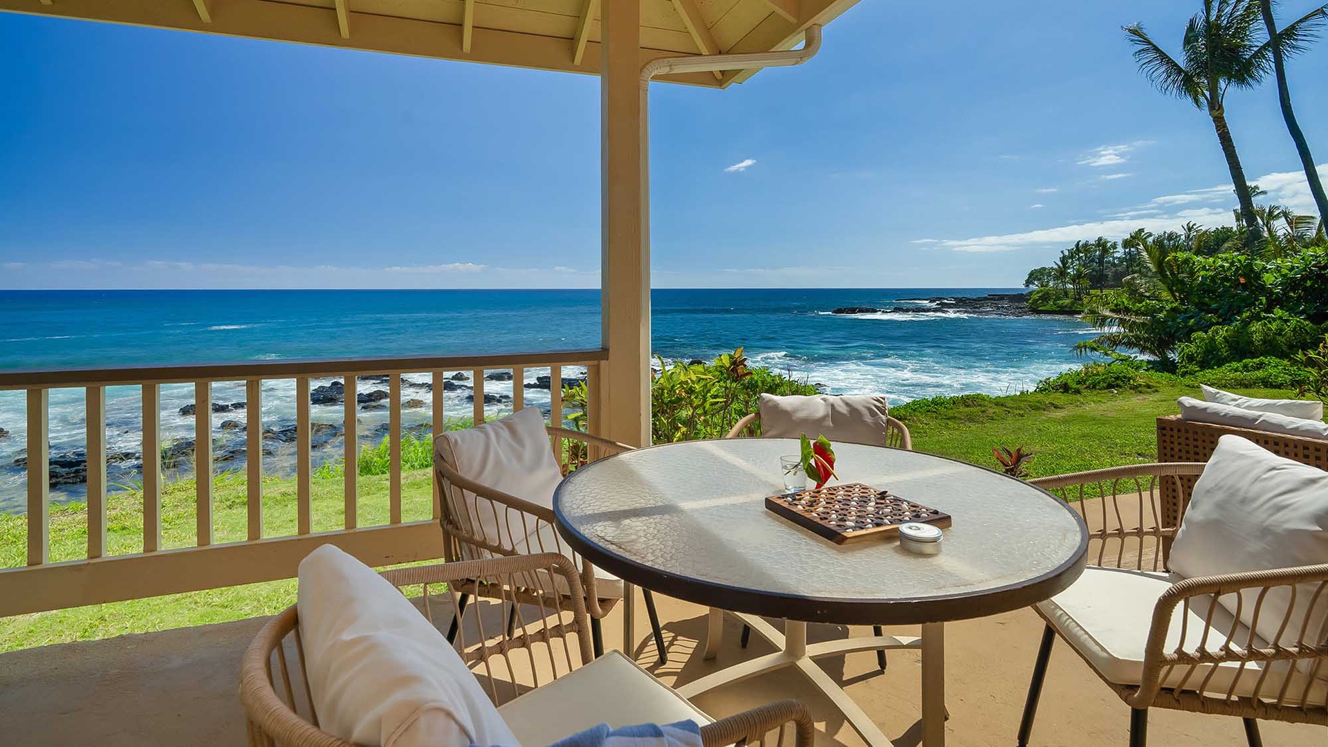 Step onto your private lanai and soak in the breathtaking ocean panorama. Lush tropical gardens frame your view, while gentle waves meet the shore—your peaceful Hawaiian escape awaits.
