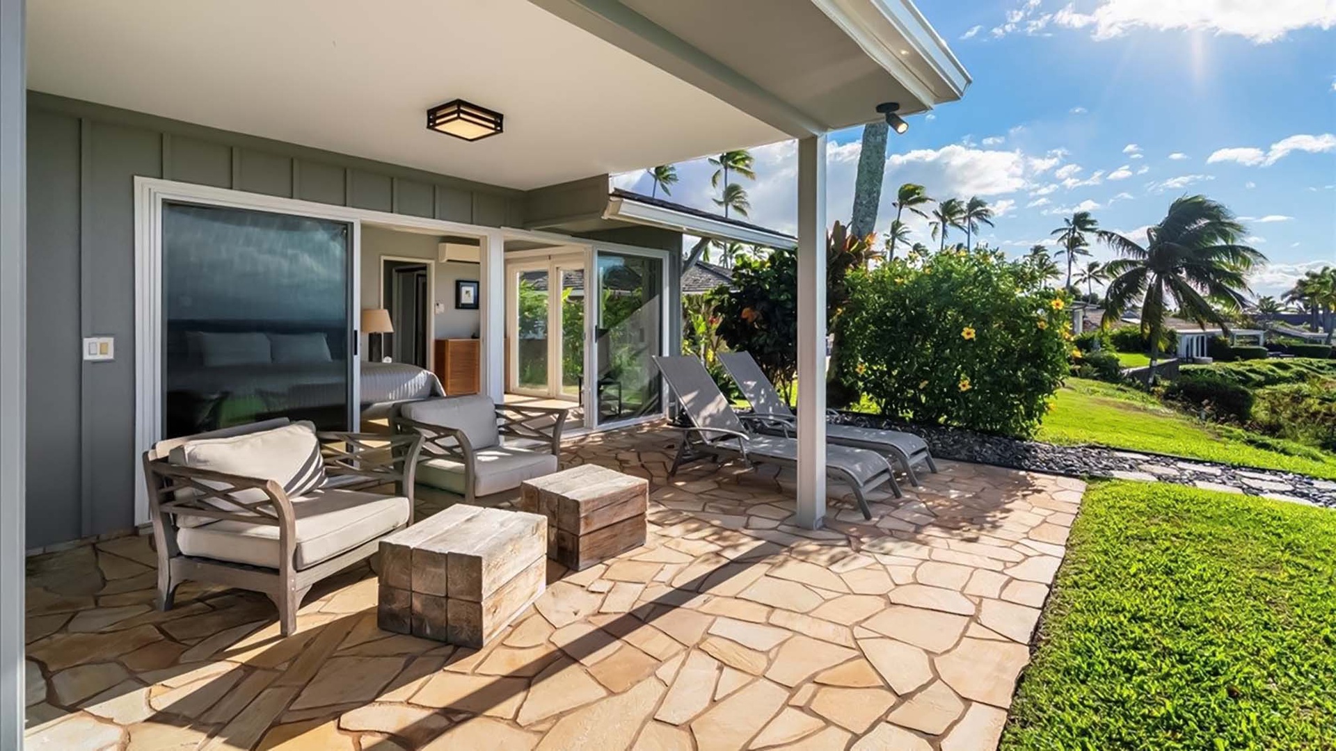 Unwind on your private covered patio with comfortable seating and tropical garden views. Perfect for morning coffee or sunset relaxation.