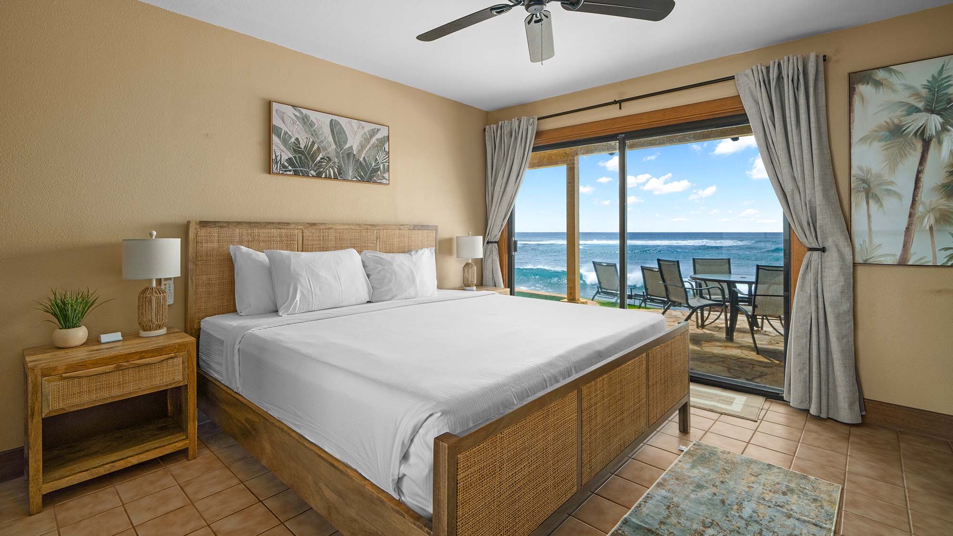 Wake up to endless ocean views from your beachfront bedroom, where tropical breezes flow through sliding doors to your private balcony.