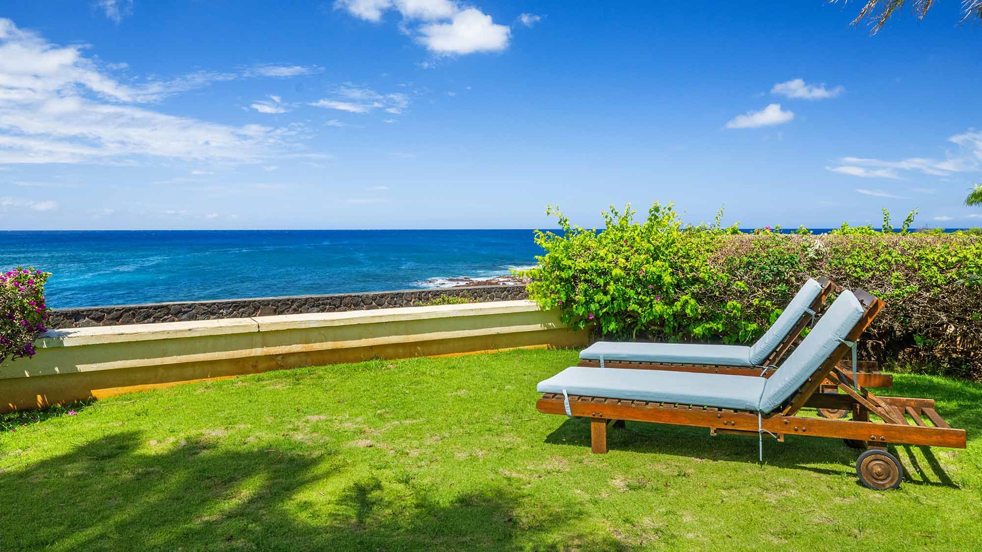 This oceanfront property offers direct access to stunning coastal views, surrounded by lush greenery and tropical landscaping. A peaceful retreat near the shoreline for relaxation and seaside tranquility.
