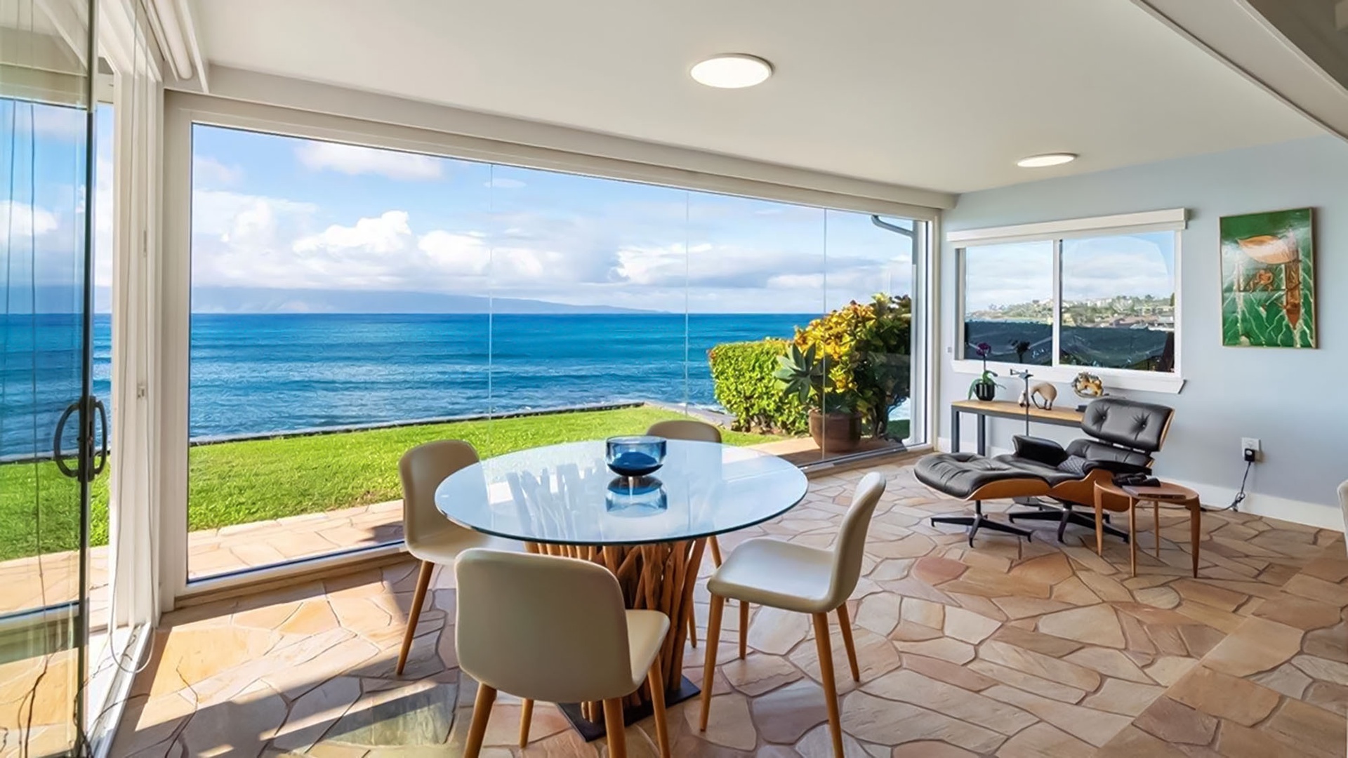 Unwind in your modern dining space where panoramic ocean views create the perfect backdrop for memorable meals.