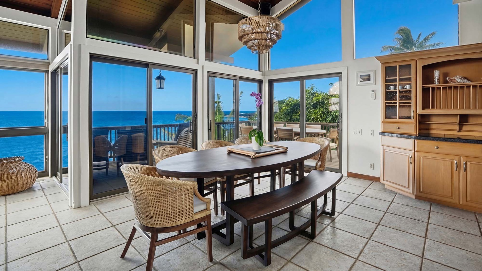 Gather around this stunning dining table where ocean views frame every meal you'll share in paradise.