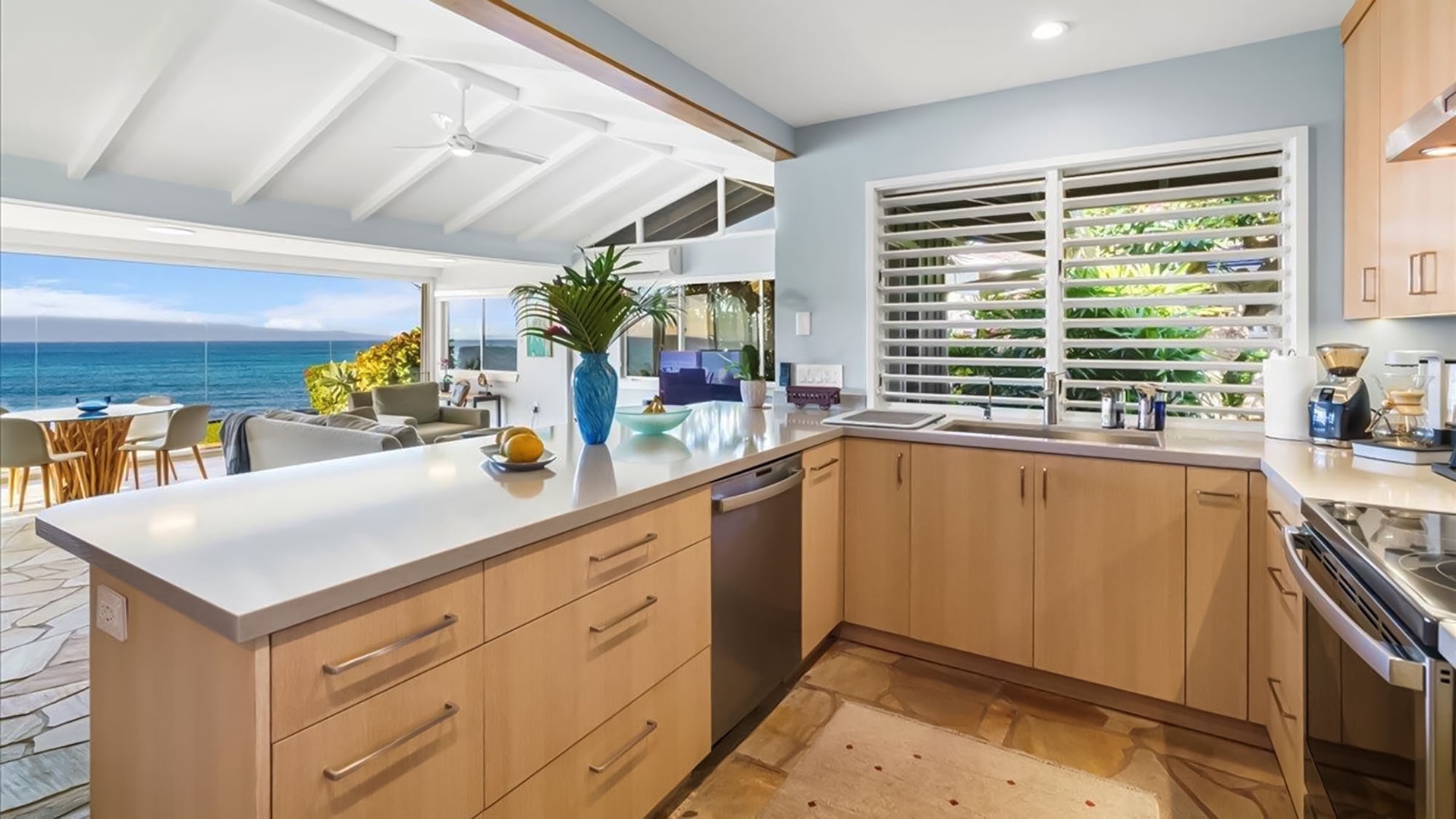 Cook with stunning ocean views from your modern kitchen, featuring sleek counters and premium appliances.