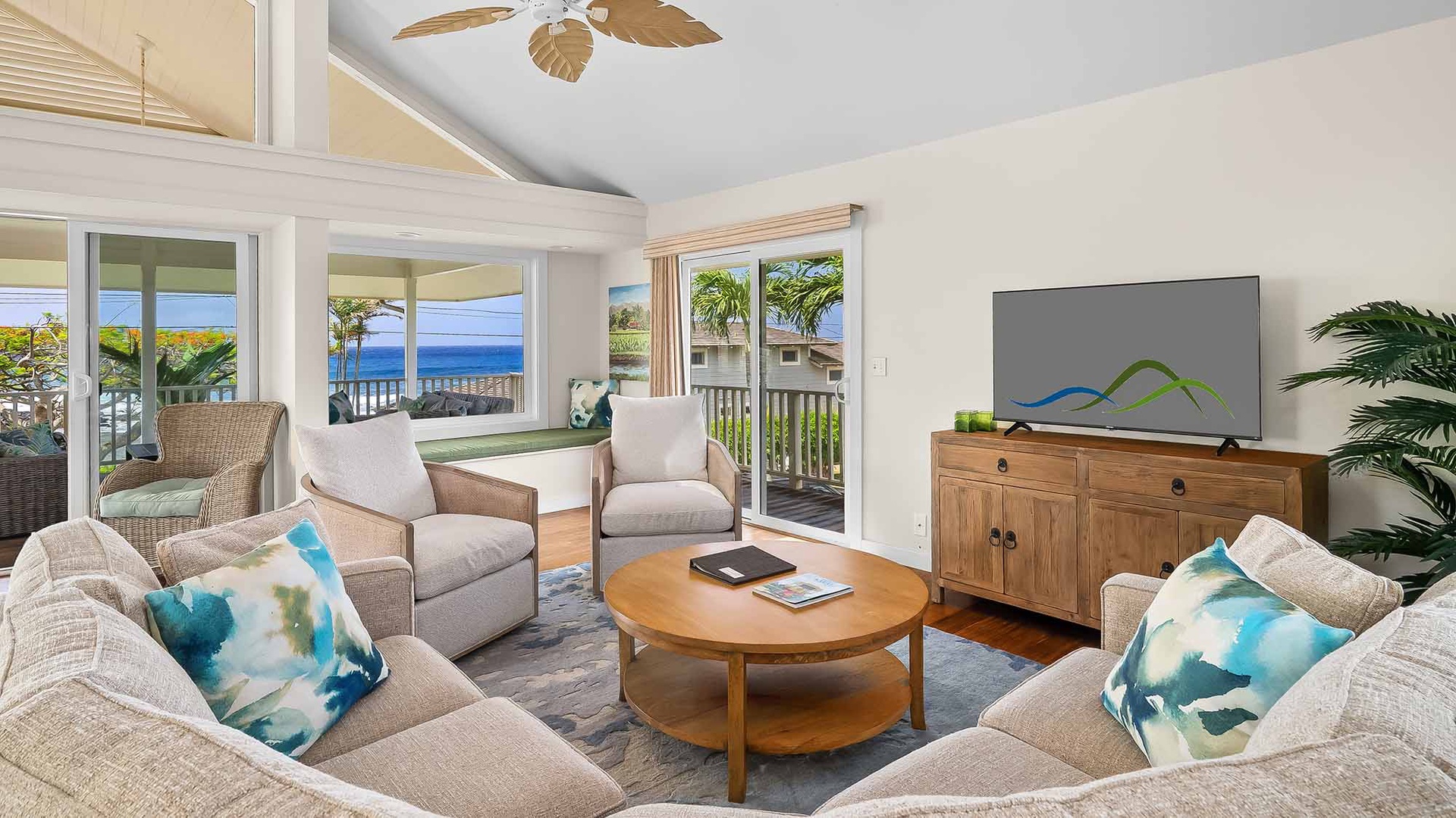 Settle into your coastal retreat where ocean breezes meet island comfort—your living room opens to sweeping sea views through sliding glass doors.