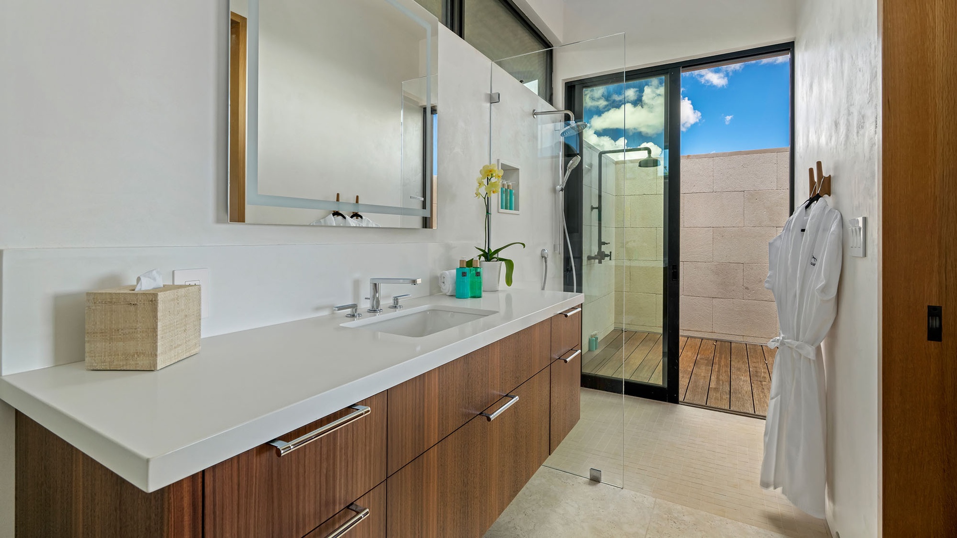 Step into your luxurious spa-inspired bathroom with sleek modern fixtures, a spacious glass-enclosed shower, and warm wood accents that create a peaceful retreat.