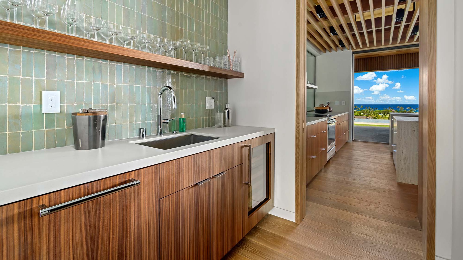 Your kitchen bar opens beautifully to stunning ocean views—ideal for prepping drinks or light meals while enjoying the blue horizon and gentle island breeze.
